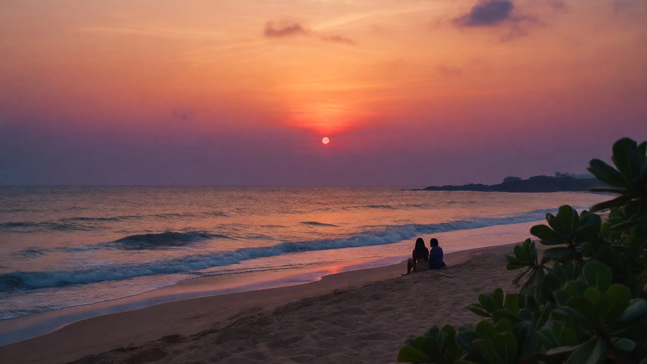 Peaceful sunset view of a couple on a quiet South Goa beach with calm waters.